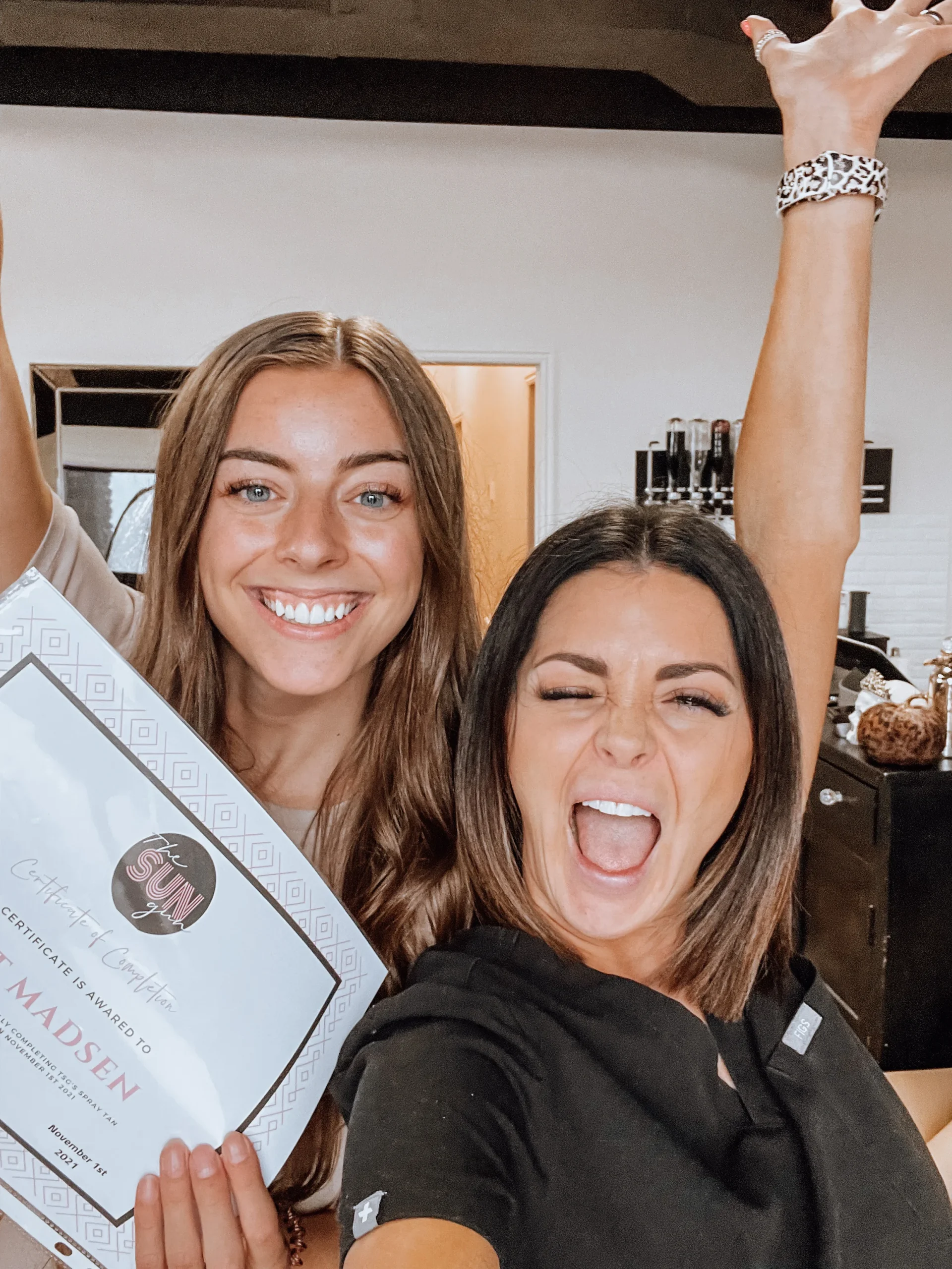 Successful spray tan professionals with thriving businesses.