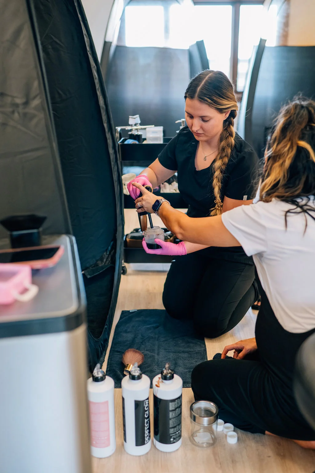 Teasha providing professional spray tan training.